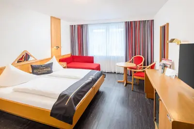Ein Bett oder Betten in einem Zimmer der Unterkunft 4-Länder-Hotel Deutschmann