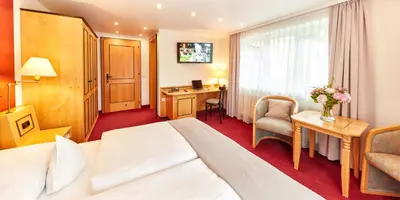 Ein Bett oder Betten in einem Zimmer der Unterkunft Hotel Riezler Hof