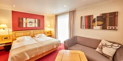 Ein Bett oder Betten in einem Zimmer der Unterkunft Hotel Riezler Hof