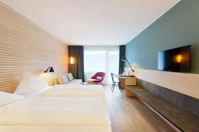 Ein Bett oder Betten in einem Zimmer der Unterkunft Hotel Weisses Kreuz