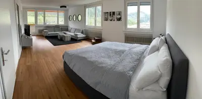 Ein Bett oder Betten in einem Zimmer der Unterkunft Skyloft Apartment Feldkirch