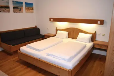 Ein Bett oder Betten in einem Zimmer der Unterkunft Hotel Andreas Hofer
