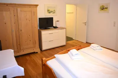 Ein Bett oder Betten in einem Zimmer der Unterkunft Hotel Andreas Hofer