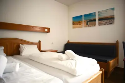 Ein Bett oder Betten in einem Zimmer der Unterkunft Hotel Andreas Hofer