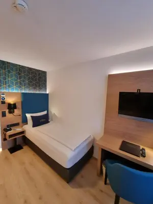Ein Bett oder Betten in einem Zimmer der Unterkunft Hotel Messmer
