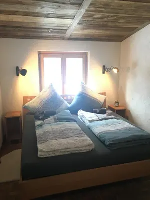 Ein Bett oder Betten in einem Zimmer der Unterkunft Bike 'n' Board Lodge Brandnertal