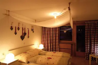 Ein Bett oder Betten in einem Zimmer der Unterkunft Alps Villa