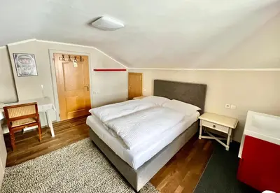 Ein Bett oder Betten in einem Zimmer der Unterkunft Lech Hostel