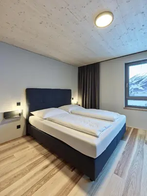 Ein Bett oder Betten in einem Zimmer der Unterkunft DER*ADLER Apartments