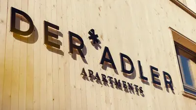 Ein Zertifikat, Auszeichnung, Logo oder anderes Dokument, das in der Unterkunft DER*ADLER Apartments ausgestellt ist