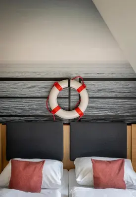 Ein Bett oder Betten in einem Zimmer der Unterkunft JUFA Hotel Bregenz