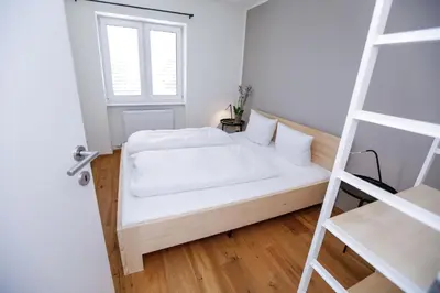 Ein Bett oder Betten in einem Zimmer der Unterkunft Terrassenwohnung in Götzis