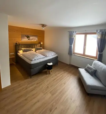 Ein Bett oder Betten in einem Zimmer der Unterkunft Landhaus Alpenland