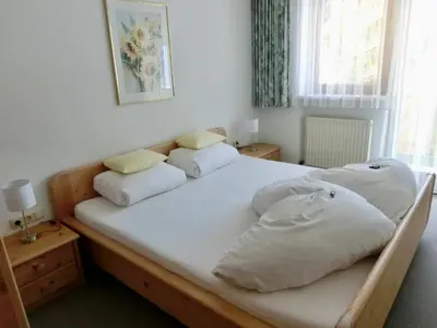 Ein Bett oder Betten in einem Zimmer der Unterkunft Haus Kristall Ferienwohnungen