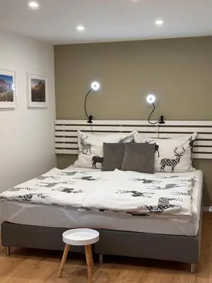 Ein Bett oder Betten in einem Zimmer der Unterkunft Alba Apartments