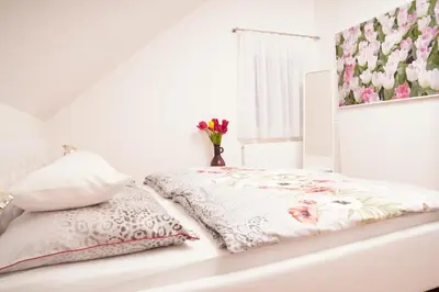 Ein Bett oder Betten in einem Zimmer der Unterkunft gemütliche Wohnung in Hohenems