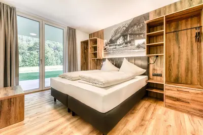 Ein Bett oder Betten in einem Zimmer der Unterkunft Brandnerhus by A-Appartments