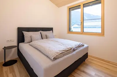 Ein Bett oder Betten in einem Zimmer der Unterkunft am Greben Apartments eins - zwei - sechs - sieben