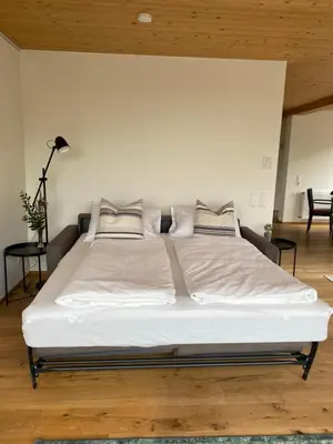 Ein Bett oder Betten in einem Zimmer der Unterkunft Penthousewohnung mit fantastischem Ausblick und KLIMAANLAGE