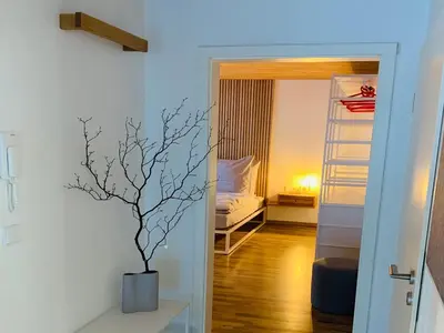 Ein Bett oder Betten in einem Zimmer der Unterkunft Dorf(er)leben Ferienwohnung im Kleinwalsertal