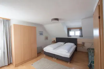 Ein Bett oder Betten in einem Zimmer der Unterkunft Wellenhof Bodensee