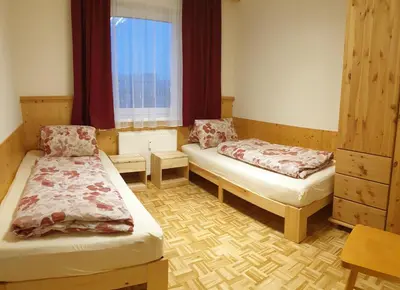 Ein Bett oder Betten in einem Zimmer der Unterkunft Alpen Appart Bludenz City