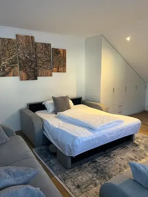 Ein Bett oder Betten in einem Zimmer der Unterkunft Ferienwohnung Alpina