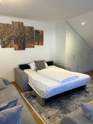 Ein Bett oder Betten in einem Zimmer der Unterkunft Ferienwohnung Alpina