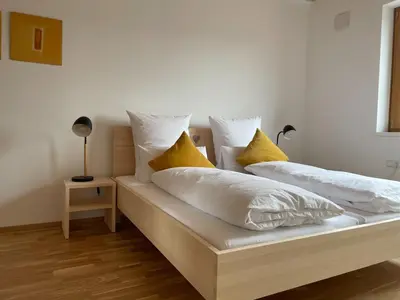 Ein Bett oder Betten in einem Zimmer der Unterkunft Gamsfels Josephine Galeriewohnung