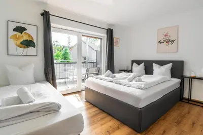 Ein Bett oder Betten in einem Zimmer der Unterkunft homy Central City Oasis in Dornbirn