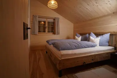 Ein Bett oder Betten in einem Zimmer der Unterkunft Hirschberghütte