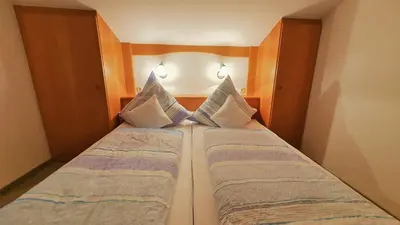 Ein Bett oder Betten in einem Zimmer der Unterkunft Haus Bergliebe Kleinwalsertal