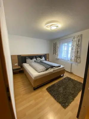 Ein Bett oder Betten in einem Zimmer der Unterkunft sonnige gemütliche FEWO