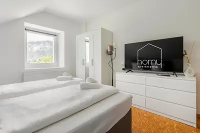 Ein Bett oder Betten in einem Zimmer der Unterkunft homy Alpenlodge